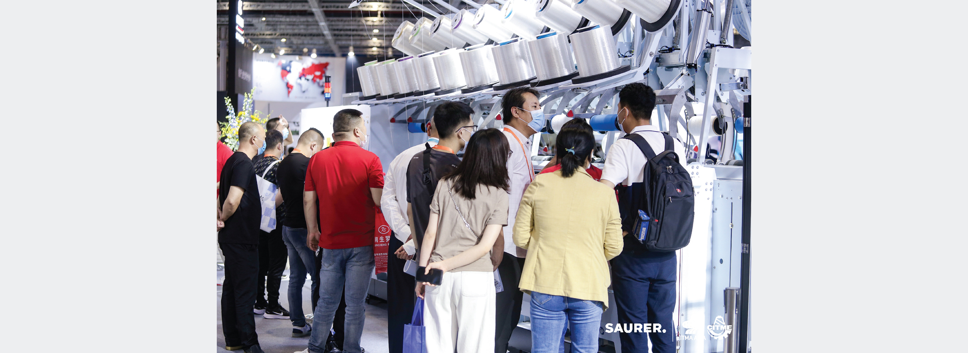 Saurer ITMA Asia visitors at machine
