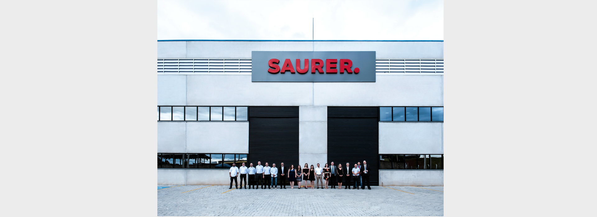 Saurer Brazil Team Outside Building